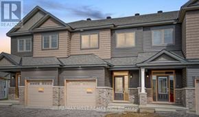 Ottawa townhouse for rent - A modern two-story house with a garage on the left side.