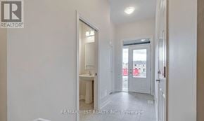Ottawa townhouse for rent - A white bathroom with a sink and mirror.