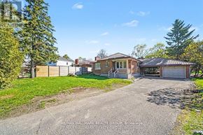Ottawa apartment for rent - A house with a driveway in front of it is for sale.