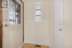 Ottawa apartment for rent - A white door with a gold handle is on the left and a white door on the right.