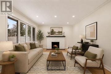 Ottawa apartment for rent - A living room with a fireplace and a painting on the wall.