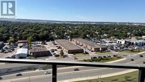 Milton (Tm Timberlea) condo for rent - A view of a parking lot from a high vantage point.
