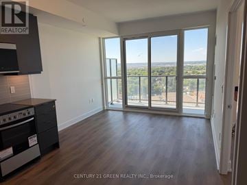 Milton (Tm Timberlea) condo for rent - A kitchen with a stove top oven and a microwave.
