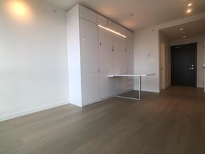 Surrey apartment for rent - A room with a white cabinet and a black door.