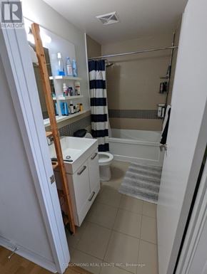 Toronto (Waterfront Communities) condo for rent - A small bathroom with a toilet, sink, and shower.
