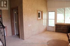 Toronto (Ionview) apartment for rent - A room with a door and a window with a white frame.
