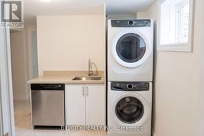 Toronto (Ionview) apartment for rent - A white washing machine and dryer in a laundry room.