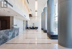 Toronto (Agincourt South-Malvern West) condo for rent - A spacious lobby with a marble floor and a row of columns.