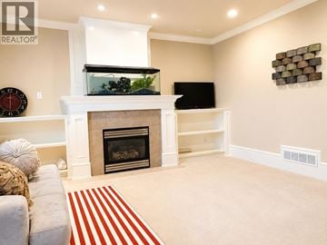West Vancouver apartment for rent - A living room with a couch and a fireplace.
