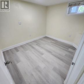 London East (East C) apartment for rent - A room with a light tan wall and a wood floor.