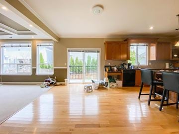 Langley apartment for rent - A kitchen with a dining table and chairs is shown.