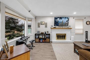Surrey apartment for rent - A living room with a fireplace and a painting on the wall.