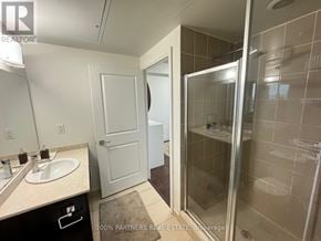 Markham (Thornhill) condo for rent - A bathroom with a sink, mirror, and shower.