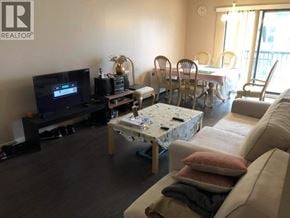 Richmond apartment for rent - A living room with a flat screen TV, a coffee table, and a couch.