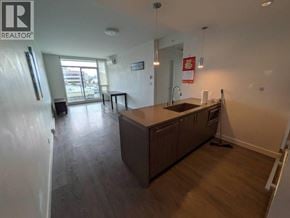Richmond apartment for rent - A kitchen with a sink, stove, and cabinets.