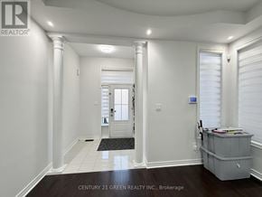 Brampton (Credit Valley) apartment for rent - A hallway with a door and a window with blinds.