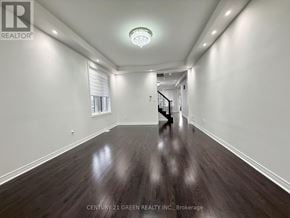 Brampton (Credit Valley) apartment for rent - A hallway with wooden floors and white walls.