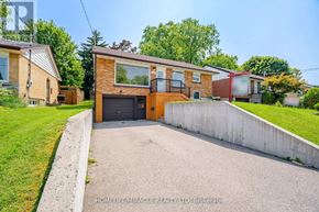 Waterloo apartment for rent - A residential area with a house and a driveway.