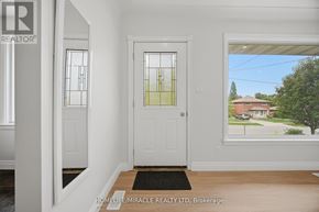 Waterloo apartment for rent - A white door with a glass window is in a room with a black doormat.