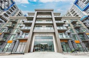 Hamilton (Waterdown) condo for rent - The front of a building with the name "Trend 2" on it.