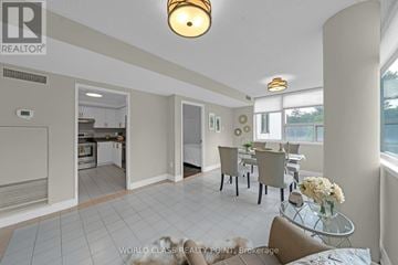 Richmond Hill (North Richvale) condo for rent - A living room with a glass table and chairs.