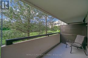 Richmond Hill (North Richvale) condo for rent - A balcony with a chair and a table is shown.