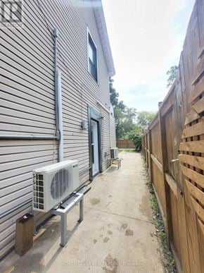Toronto (Junction Area) multi-family for rent - A house with a wall made of wooden slats.