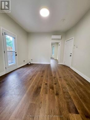 Toronto (Junction Area) multi-family for rent - A room with wooden flooring and white walls.