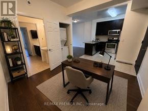 Vaughan (West Woodbridge) condo for rent - A well-lit, modern kitchen with a dining table and chairs in the foreground.