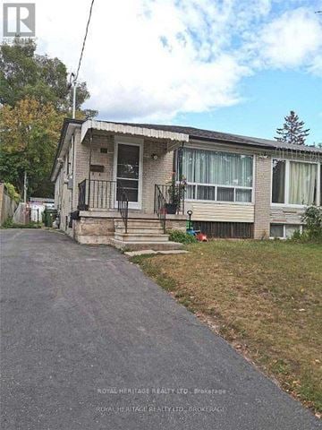Toronto (Clairlea-Birchmount) apartment for rent - A house with a white door and a balcony is for sale.