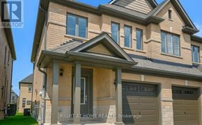 Barrie (Painswick South) apartment for rent - A two-story house with a garage on the right side.