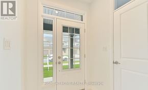 Barrie (Painswick South) apartment for rent - A white door with a glass window and a handle.