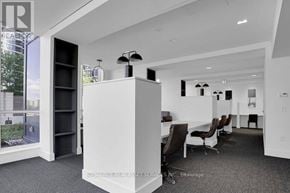 Toronto (Islington-City Centre West) condo for rent - A white reception desk with a black chair in front of it.