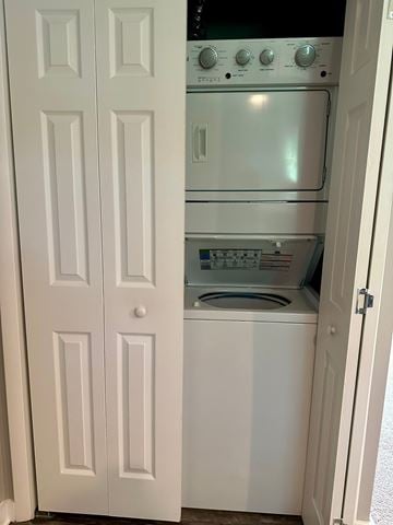 Charlottesville apartment for rent - A white door is open to a small kitchen with a stove and oven.