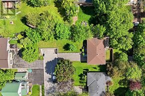 Haldimand apartment for rent - A bird's eye view of a residential area with houses and trees.