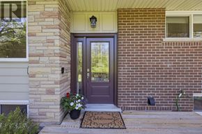 Haldimand apartment for rent - A house entrance with a welcome mat and a flower pot.
