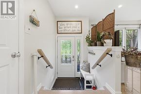 Haldimand apartment for rent - A hallway with a white door and a sign on the wall.