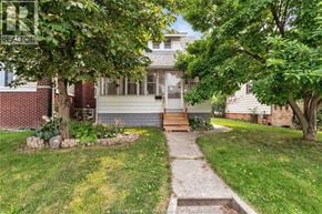 Windsor apartment for rent - A house with a front yard and a pathway leading to the front door.