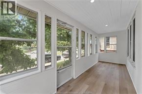 Windsor apartment for rent - A sunny day in a white room with wooden floors and windows.