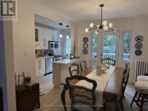 Toronto (Lawrence Park South) fourplex for rent - A dining room with a table set for two and a kitchen in the background.