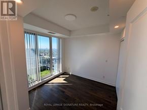 Richmond Hill (Langstaff) condo for rent - A room with a view of the city through the windows.