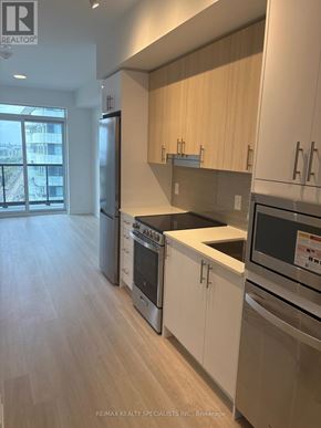 Mississauga (Hurontario) condo for rent - A kitchen with white cabinets and stainless steel appliances.