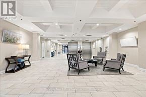 Burlington (Brant) condo for rent - A spacious waiting area with a row of chairs and a bench.