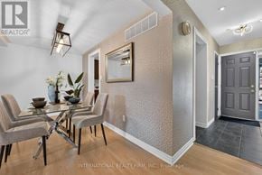 Mississauga (Meadowvale) townhouse for rent - A dining room with a glass table and chairs.
