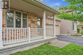 Ottawa apartment for rent - A house with a white porch and a brick wall.