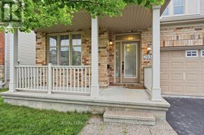 Ottawa apartment for rent - A house with a porch and a garage door.