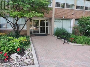 Toronto (Banbury-Don Mills) apartment for rent - A brick walkway leads to a glass door entrance.