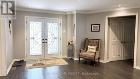 Richmond Hill (Mill Pond) apartment for rent - A room with a chair and a door.