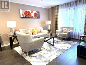 Richmond Hill (Mill Pond) apartment for rent - A living room with a large chair and a painting on the wall.