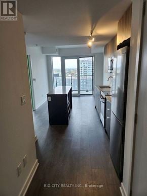 Toronto (Clanton Park) condo for rent - A kitchen with a refrigerator, sink, and stove.